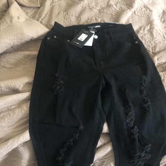 New never wore jeans. All black with little holes. - Picture 3 of 5